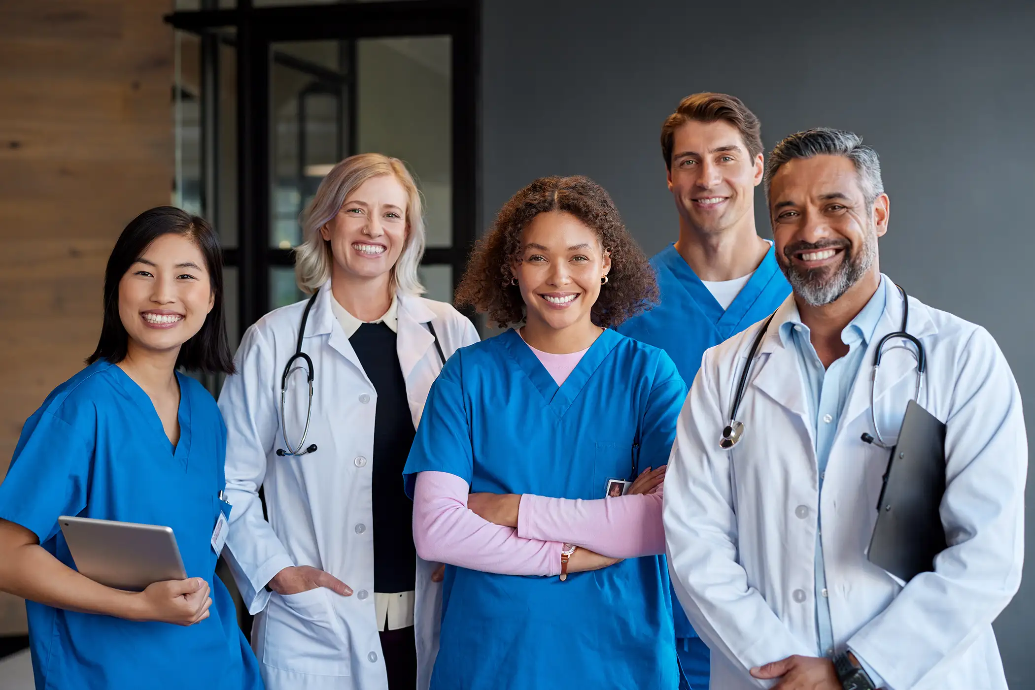 AdobeStock_1389198981 copy Portrait of happy smiling healthcare team looking at camera